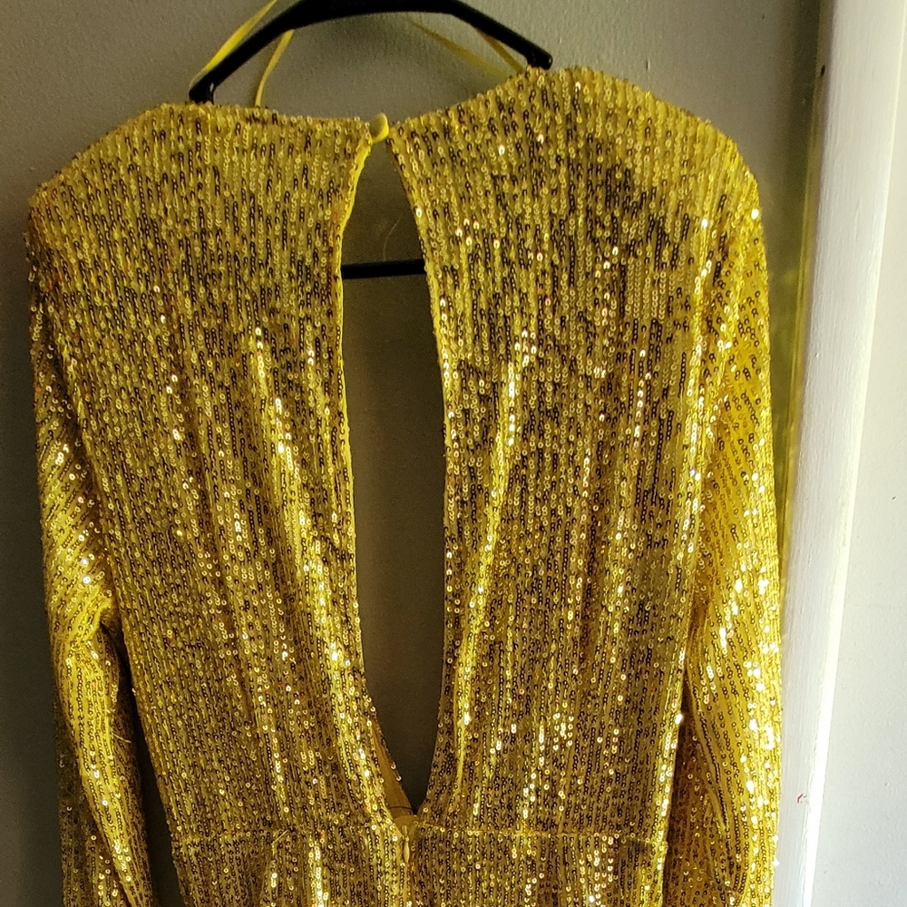 Yellow sparkling dress.